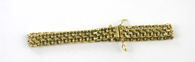 Lot 424 - A yellow metal curb link bracelet, length 20cm,...