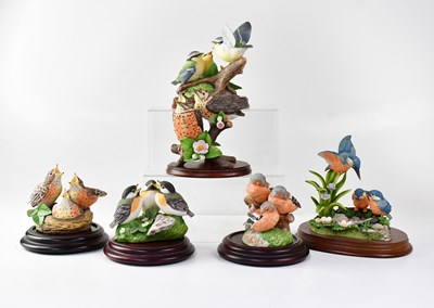 Lot 272 - FRANKLIN MINT; four bird figure groups,...