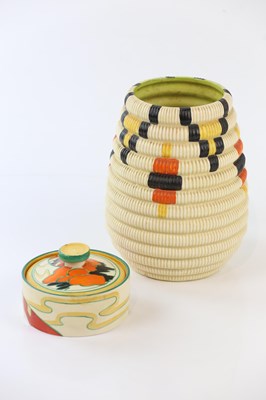 Lot 2308 - CLARICE CLIFF; a preserve jar and cover...