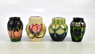 Lot 2300 - MOORCROFT; four pieces including an 'Indigo'...