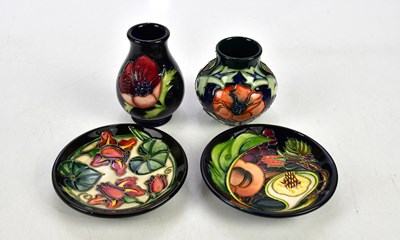 Lot 2360 - MOORCROFT; four pieces including two pin...
