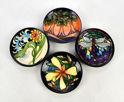 Lot 2312 - MOORCROFT; four pin dishes including an...