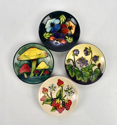 Lot 2313 - MOORCROFT; four circular pin dishes including...