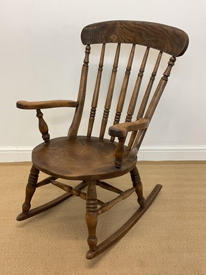 Lot 566 - An ash and elm high bar back Windsor type...