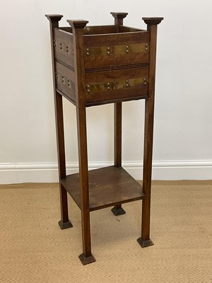 Lot 474 - An Arts and Crafts oak and stud decorated...