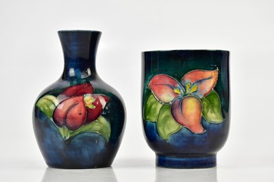 Lot 2872 - MOORCROFT; two 'Freesia' pattern vases,...