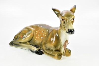 Lot 2482 - A large modern ceramic model of a recumbant...