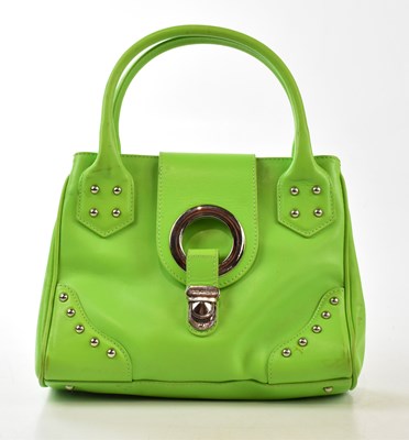 Lot 780 - DOLCE & GABBANA; a bright green leather...