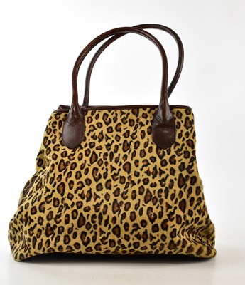 Lot 778 - DKNY; an animal printed fur handbag with brown...