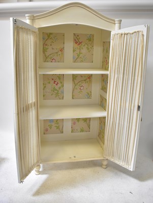 Lot 84 - LAURA ASHLEY; a white painted armoire with a...