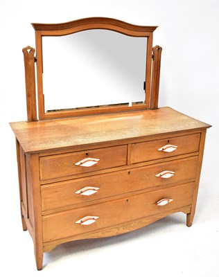 Lot 37 - An Arts and Crafts style oak dressing chest...