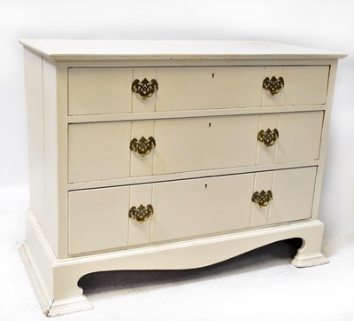 Lot 30 - A white painted chest of three drawers raised...