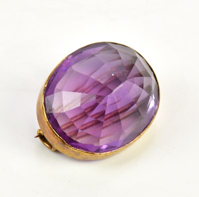 Lot 387 - An amethyst and yellow metal mounted brooch,...