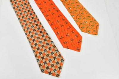 Lot 793 - HERMÈS; three 100% silk ties to include an...