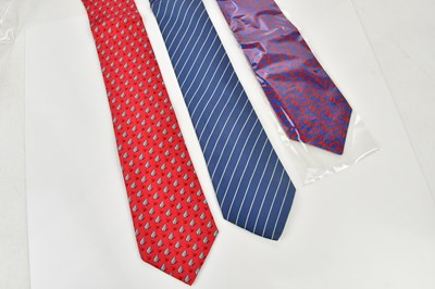 Lot 822 - HERMÈS; two silk ties including a red frog tie...