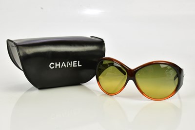 Lot 802 - CHANEL; a pair of brown framed sunglasses with...