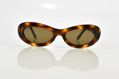 Lot 803 - CHANEL; a pair of brown framed sunglasses with...