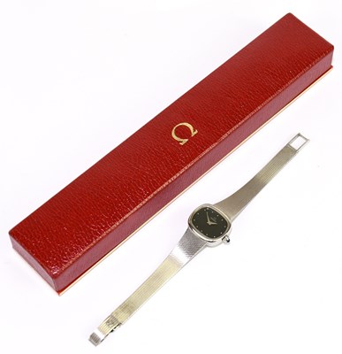 Lot 1637 - OMEGA; a lady's 9ct white gold wristwatch,...