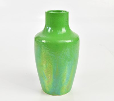Lot 2265 - RUSKIN; a green lustre glazed bottle vase of...