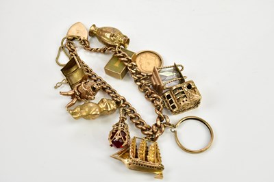 Lot 400 - A 9ct yellow gold charm bracelet with 9ct gold...