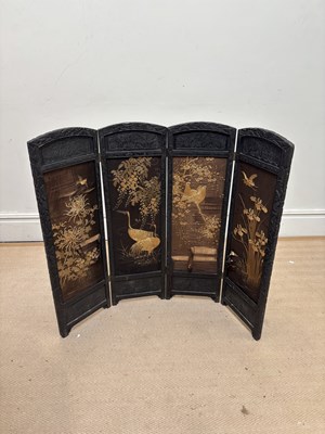 Lot 2708 - A 20th century ebony framed four section...