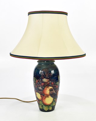 Lot 2758 - MOORCROFT; a 'Finch' pattern lamp with shade,...