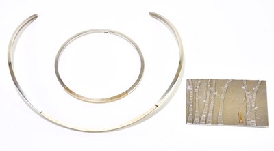 Lot 1564 - A silver collar, a matching bangle, and a...