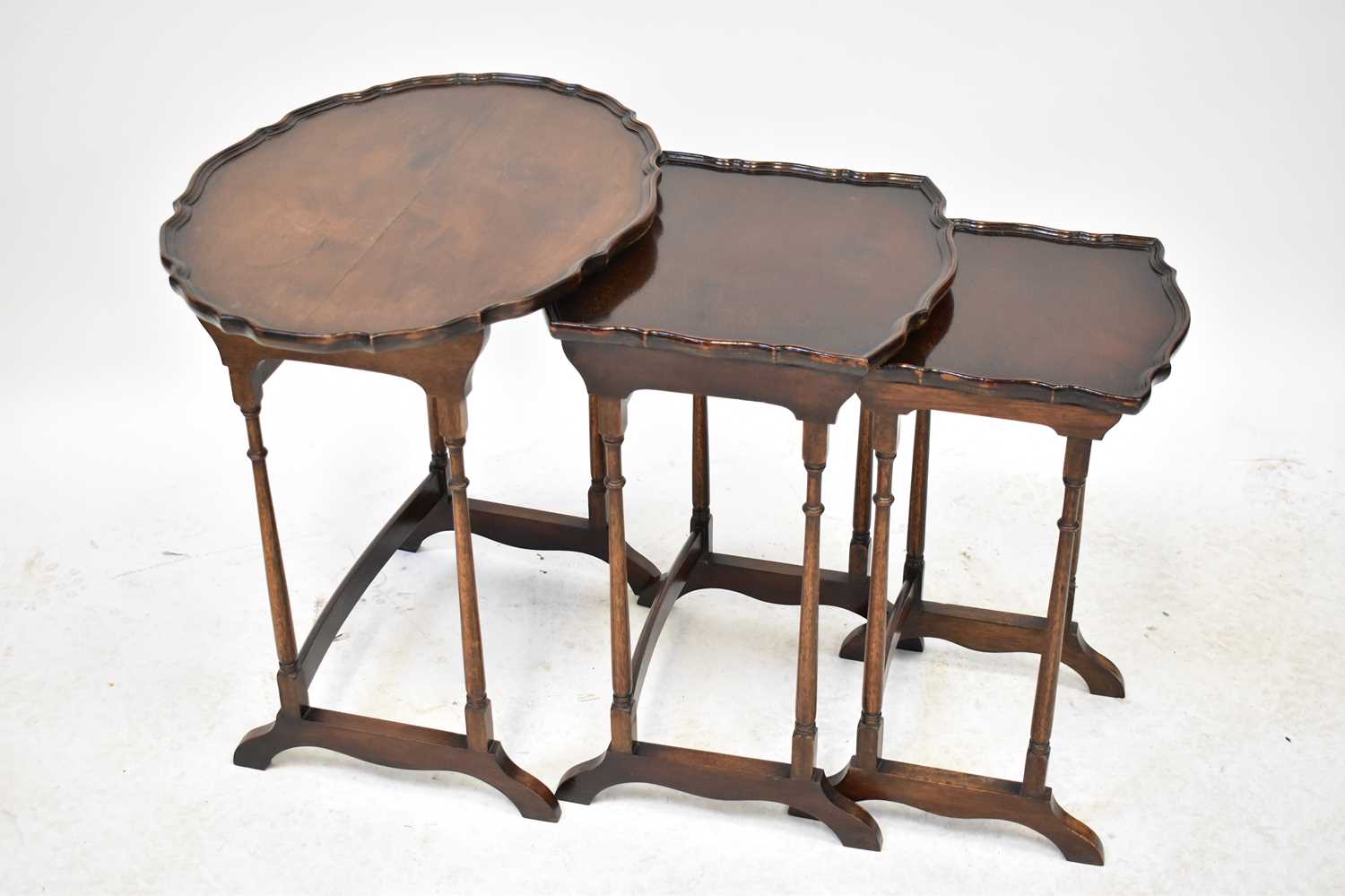 Lot 32 - An Edwardian mahogany nest of tables, each...