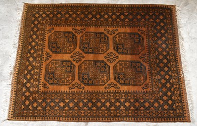 Lot 1441 - An Afghan rug with elephant foot decoration to...