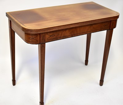 Lot 25 - A 19th century inlaid mahogany fold-over tea...