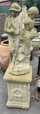 Lot 1262 - A modern reconstituted stone figure of a boy...