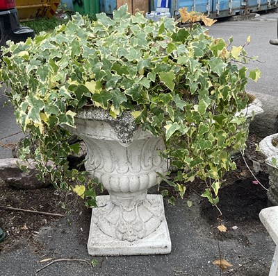 Lot 1258 - A modern reconstituted stone pedestal urn on...