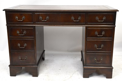 Lot 1746 - A reproduction mahogany knee-hole desk with...