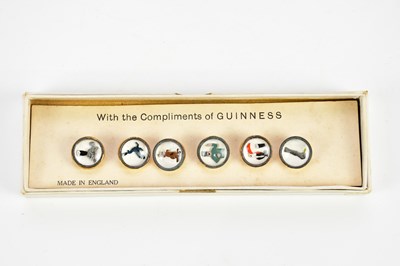 Lot 1510 - A cased set of vintage Guinness buttons.