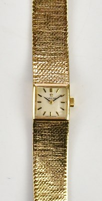 Lot 556 - OMEGA; a lady's vintage 9ct gold wristwatch...