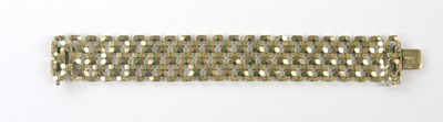 Lot 399 - A broad 9ct gold openwork bracelet, length...