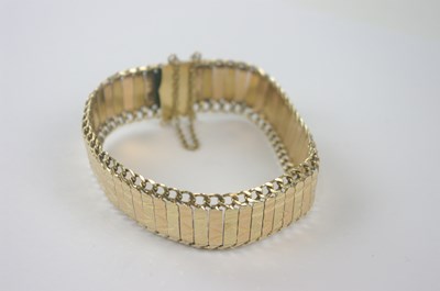 Lot 442 - A yellow metal sectioned bracelet with...
