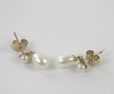 Lot 333 - A pair of 9ct yellow gold and pearl drop ear...