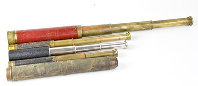 Lot 773 - Four leather-covered three-draw brass...