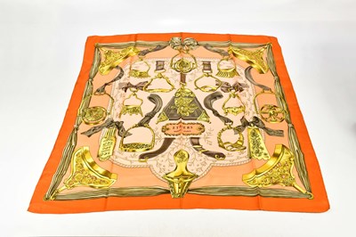 Lot 812 - HERMÈS; a 100% silk Etriers peach, orange and...