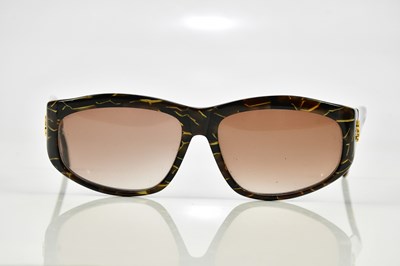 Lot 838 - YVES SAINT LAURENT; a pair of brown and gold...