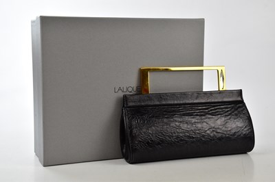 Lot 733 - LALIQUE; a black embossed leather clutch bag...