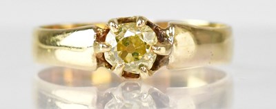 Lot 1079 - An 18ct gold ring with claw set yellow diamond,...