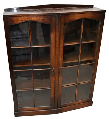 Lot 1563 - A 1920s oak two door display cabinet, on...