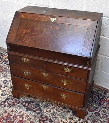 Lot 1494 - An 18th century oak bureau, with fall front...
