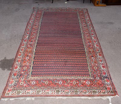 Lot 1445 - A large carpet with stylised detail to the...