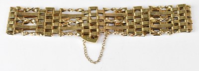 Lot 1152 - A 9ct gold five-bar gate bracelet united with...