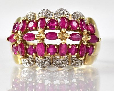 Lot 1103 - A 9ct gold ruby cluster dress ring with a...