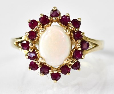 Lot 1101 - An 9ct gold opal and ruby set ring, the claw...