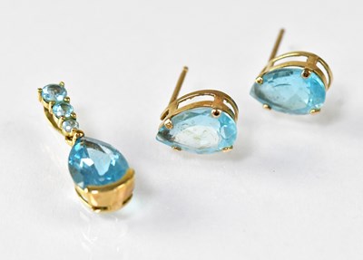Lot 1229 - A pair of pear-shaped blue topaz stud earrings...